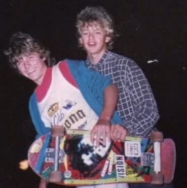 Marc Mulvaney as a teenager with a friend, holding a skateboard at night